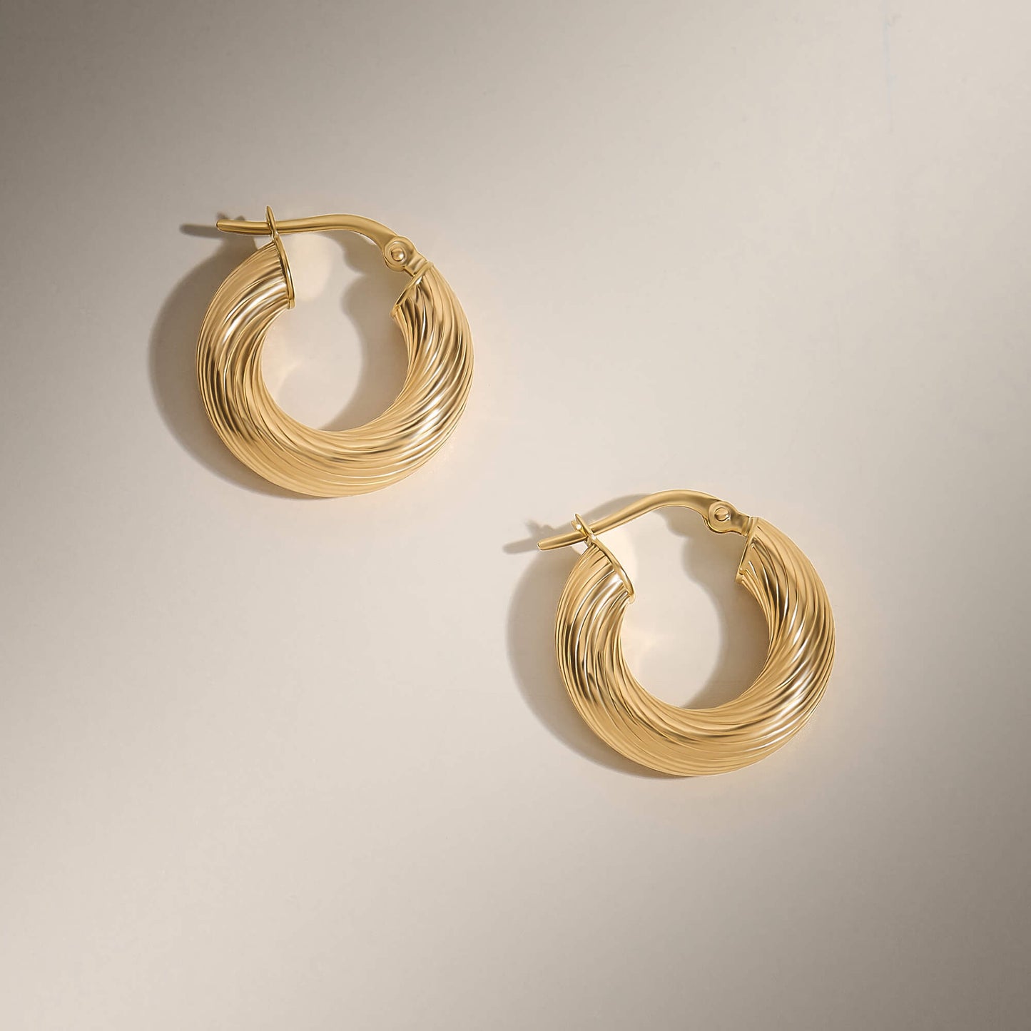 Bold Twist Hoop Earrings in Gold
