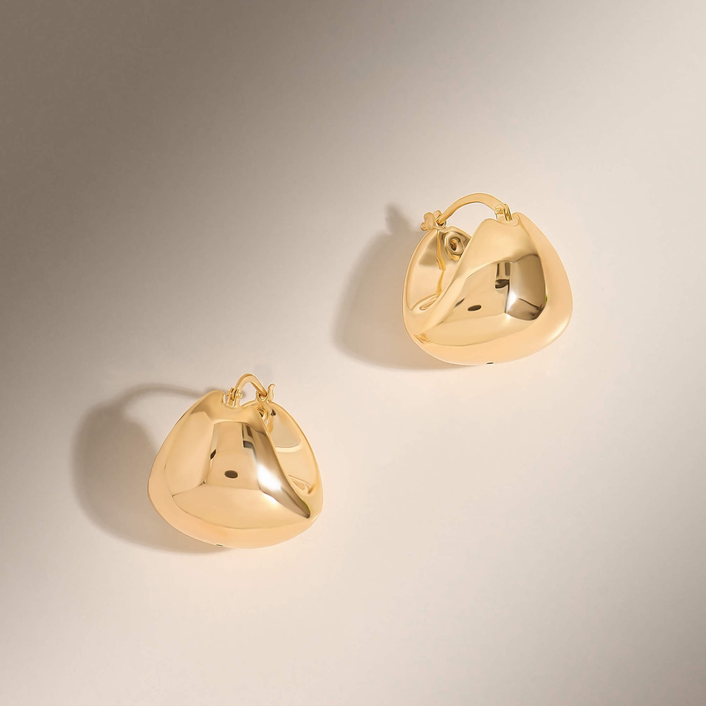 Chunky Huggie Earrings in Gold