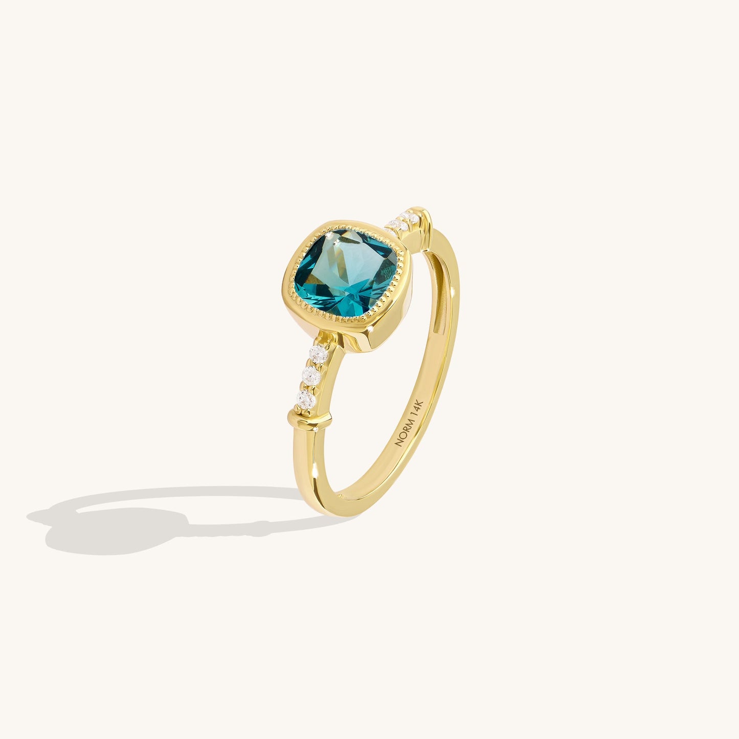 Cushion Blue Topaz Solitaire Ring in Gold