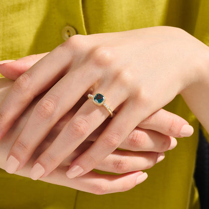 Cushion Blue Topaz Solitaire Ring in Gold