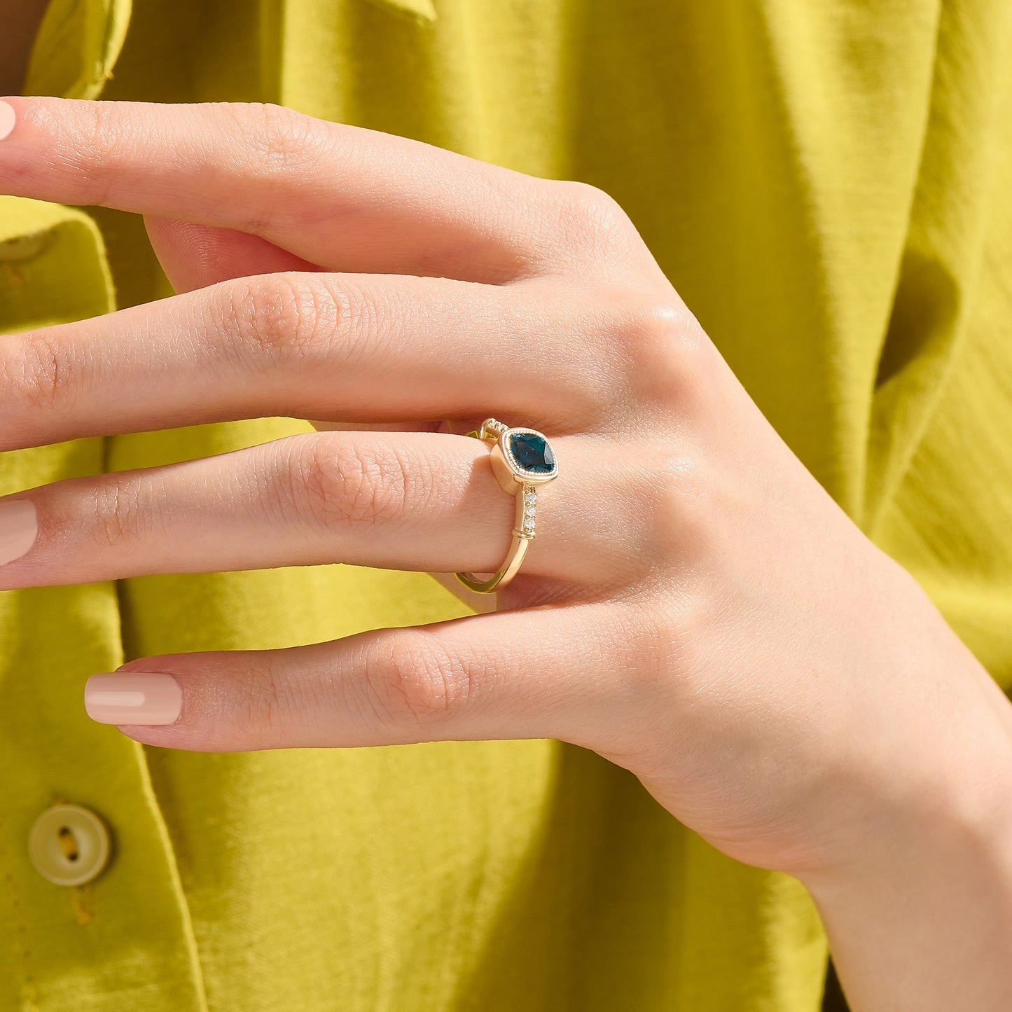 Cushion Blue Topaz Solitaire Ring in Gold