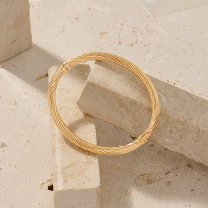 Hinged Twist Bangle Bracelet in Gold