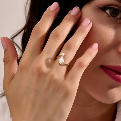 Moissanite Pear Solitaire Swirl Ring in Gold
