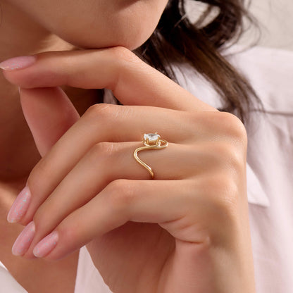 Oval Moissanite Solitaire Swirl Ring in Gold