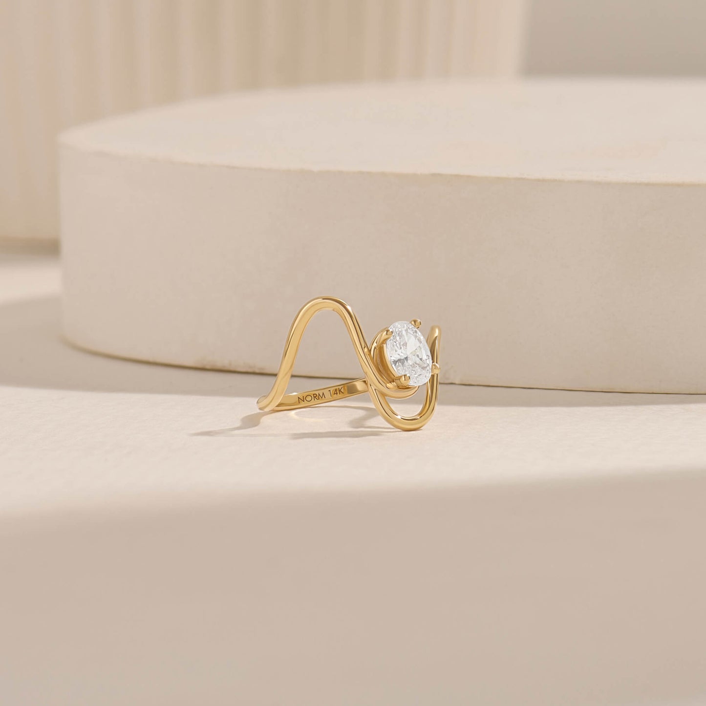 Oval Moissanite Solitaire Swirl Ring in Gold