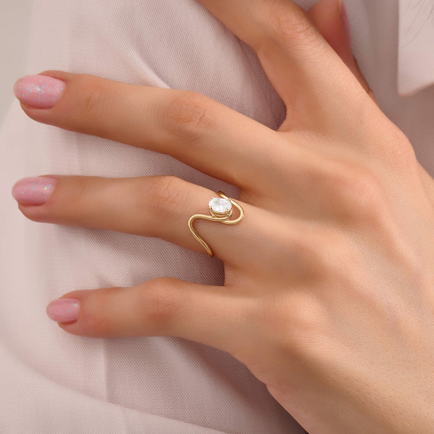 Oval Moissanite Solitaire Swirl Ring in Gold