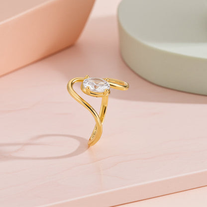 Oval Moissanite Solitaire Swirl Ring in Gold