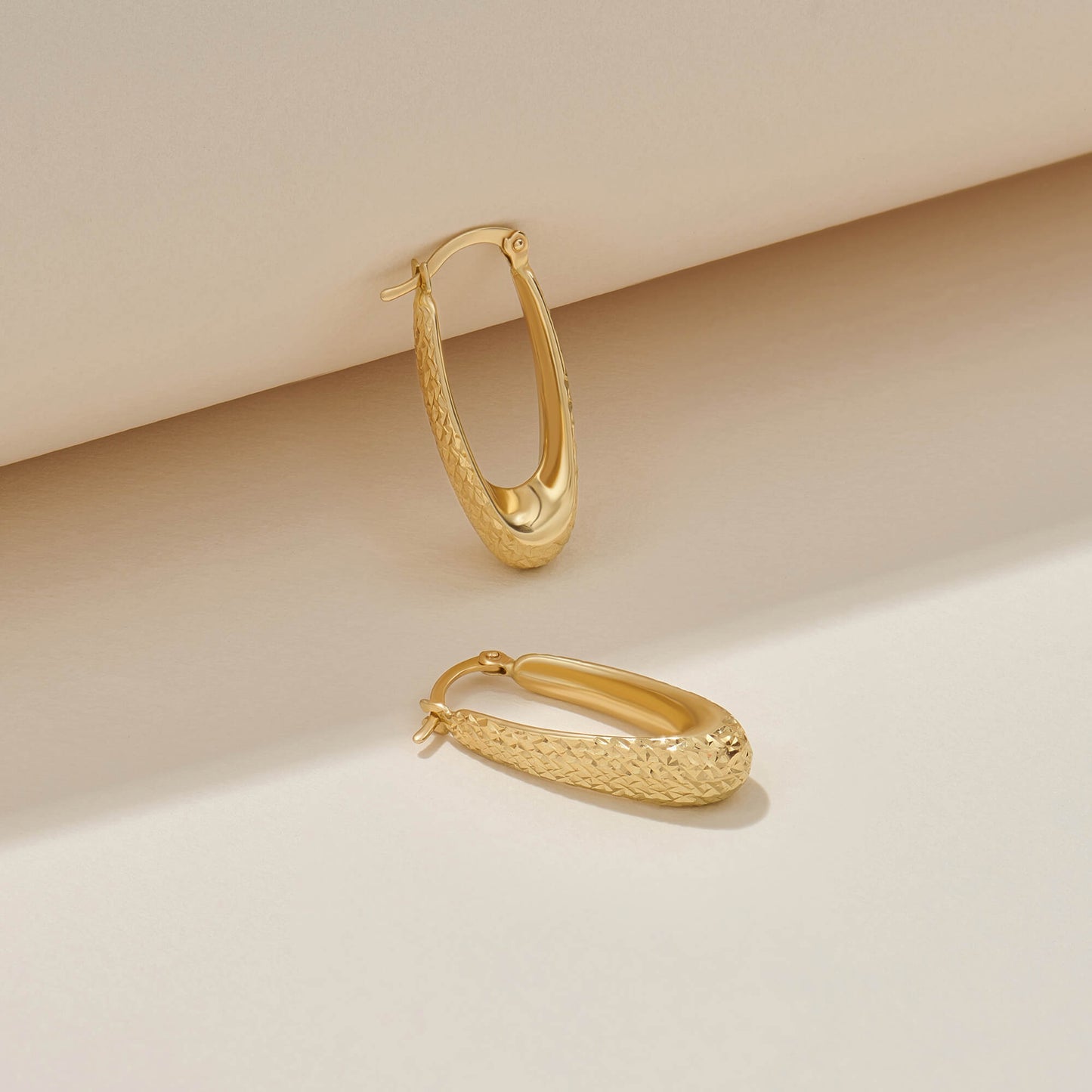 Textured Elongated Hoop Earrings in Gold